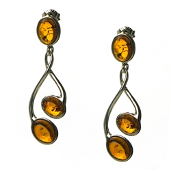 Honey amber drop earrings, with sterling silver post backs. Amber is soft, only slightly harder than talc, and should be treated with care.