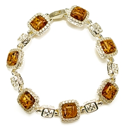 7 square amber beads each set in a sterling silver frame. 7" - 18cm long. Each amber square is approx 1cm.