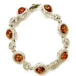 7 round amber beads each set in a sparkling sterling silver frame. 7" - 18cm long.