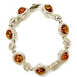 7 round amber beads each set in a sparkling sterling silver frame. 7" - 18cm long.