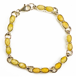 Fine 7" - 18cm bracelet composed of milky oval Baltic Amber beads. Bead size 7mm long.