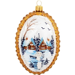 Beautiful hand-painted winter scenes grace both sides of this unique medallion hand-crafted of glass in Poland. Picturesque cabins amidst snow-capped pines are awash in restful hues, of gold, blue and white. Adorned with accents of iridescent glitter