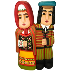 Cute Lowicz folk couple hand carved and painted by Master artist Andrzej Cichon from Kutno.  Mr Cichon signs his work by carving a stylized version of his initials on the bottom of this carving.