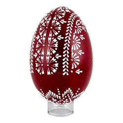 This beautifully designed egg is dyed one color then white wax is melted and applied to form an intricate design which is left on the surface. The egg is emptied. Stand not included.