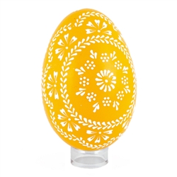 This beautifully designed egg is dyed one color then white wax is melted and applied to form an intricate design which is left on the surface. The egg is emptied. Stand not included.