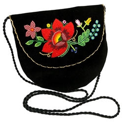 Hand beaded purse made from velvet. Fully lined. Extra long strap. Snap closure. Made in Lowicz, Poland.