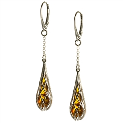 Honey amber drop tear earrings enclosed in silver webbing with European lever back fittings. Amber is soft, only slightly harder than talc, and should be treated with care.