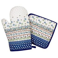 Colorful set of decorative mitt and holder set featuring a traditional Polish stoneware design. 100% polyester.  These mitts are more decorative than useful as they do not have effective insulating material. Decorative only - not intended to handle heat.