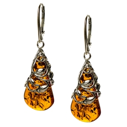 Honey amber drop tear earrings enclosed in silver webbing with European lever back fittings. Amber is soft, only slightly harder than talc, and should be treated with care.