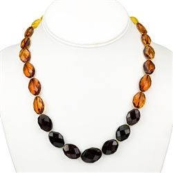 This beautiful necklace features faceted amber beads from light to dark and graduated in size from 1 up to 2cm long.