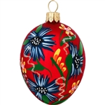 Sparkling glitter accents combine with a beautiful flower design on a radiant red satin background to create this egg-ceptionally egg-citing ornament! Blooming with a unique blend of springtime splendor and Christmas charm, this 2" tall red flowered egg