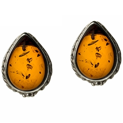 Artistic tear drop shaped silver earrings with a center of honey colored amber. Size approx .6" x .5".