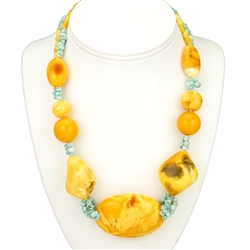 Bozena Przytocka is a designer of artistic amber jewelry based in Gdansk, Poland.   Here is a beautiful example of her ability to blend Baltic Amber and Larimar from the Dominican Republic to create a stunning necklace.