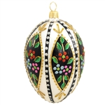 Add a glistening addition to your holiday decor with this beautiful egg! Crafted of glass in Poland and painted a cream white, this 4" egg is accentuated with vibrant green, black and gold glazes, and dazzling gold, green, red, silver, blue and pink