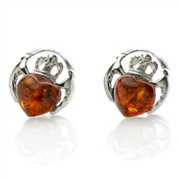 Its shape is enough to convey the message that it bears - two hands holding an amber heart, which has a silver crown on its head. It is said that Claddagh upholds the emotions of love, friendship, loyalty, and affection.