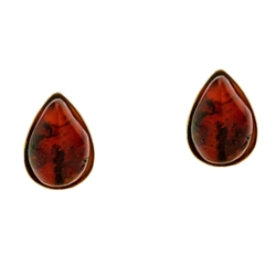 Artistic tear drop shaped silver post back earrings with a center of cherry colored amber.