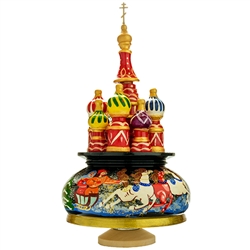 This beautiful music box made in the shape of Saint Basil's Cathedral is constructed of seasoned Linden wood. Hand painted winter scene around the base. Winding the cathedral clockwise plays the popular Russian melody, "Midnight In Moscow".