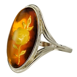 Unique and lovely honey amber rose blossom set in sterling silver ring! The exquisitely detailed rose design is hand-carved from the reverse side of the amber.  Size approx .8" x .5".