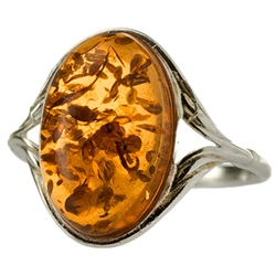 Medium size honey oval amber set in sterling silver.  Size approx .75" x .5".