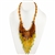 Bozena Przytocka is a designer of artistic amber jewelry based in Gdansk, Poland. Here is a beautiful example of her ability to blend amber, amethyst and peridot to create a stunning necklace.