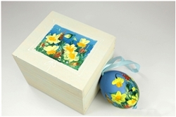 Hand painted duck egg nested inside a hand painted wooden box with a matching floral scene. The duck egg is blown out and comes with a ribbon hanger. Magnetized lid. Hand made so no two eggs or boxes are exactly the same.