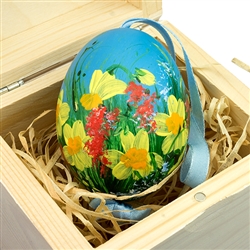 Hand painted duck egg nested inside a hand painted wooden box with a matching floral scene. The duck egg is blown out and comes with a ribbon hanger. Magnetized lid. Hand made so no two eggs or boxes are exactly the same.