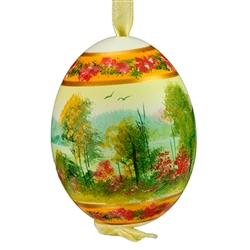 This beautiful hand painted duck egg comes ready to hang. The eggs have been emptied and strung through with ribbon for hanging. No two eggs are exactly alike and ribbon colors vary as well.