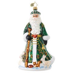 Evergreen and surrounded by forest creatures, this Old World Santa presides over the woodland wonder.