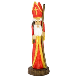 This St. NIcholas was carved and painted by Polish folk artist Andrzej Cichon from Kutno. Mr Cichon signs his work by carving a stylized version of his initials on the bottom of this carving. The body is carved from one block of wood (approx 15.5" x 5.5"