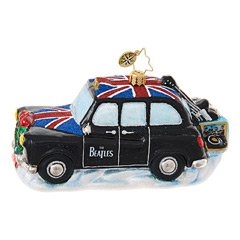 You’ll not miss a beat in this dashing cab! The Beatles are zipping around London in their very own black taxi, carrying their instruments to the next gig. They even brought along their very own record player, just in case they want to listen to a few tun