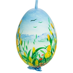 This beautiful hand painted goose egg comes ready to hang. The eggs have been emptied and strung through with ribbon for hanging. No two eggs are exactly alike and ribbon colors vary as well.