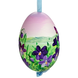 This beautiful hand painted goose egg comes ready to hang. The eggs have been emptied and strung through with ribbon for hanging. No two eggs are exactly alike and ribbon colors vary as well.