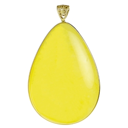 This elegant tear drop shaped amber cabochon is suspended in a 14kt gold ring and bale.