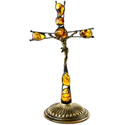 Hand made in Gdansk, the beautiful crucifix is made with natural Baltic amber embedded in an artistic cross. Brass base and body of Christ. Removable base.