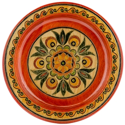This Polish plate is made from beech wood in the mountain region of southern Poland called Podhale.  The plates are cut and shaped on a lathe by hand.  The floral designs are burned into the wood then painted after staining and varnishing.  All the flower