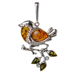 Our silver bird is studded with cubic zirconia and highlighted with Baltic amber.  Size approx 1.75" x 1".