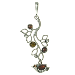 Artistic silver work highlighted with Baltic amber.  Size approx 2" x 1".