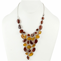 Elegantly designed cluster of interlocking amber cabachons each framed in silver create one stunning necklace (in our opinion).
We think you will agree.  Adjustable to 16".