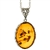Beautiful sterling silver pendant and adjustable length chain, framing a large oval shaped amber cabochon.