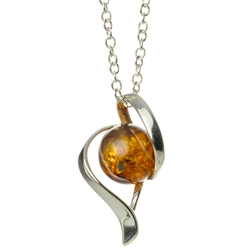 Artistic sterling silver pendant and adjustable length chain, surrounding a honey amber sphere.