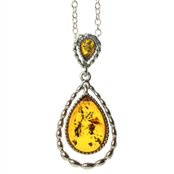 Beautiful sterling silver pendant and adjustable length chain, featuring two teardrop shaped amber cabochons in honey and green color.