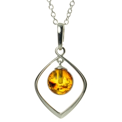 Elegant sterling silver pendant and adjustable length chain, framing a beautiful sphere of honey amber.