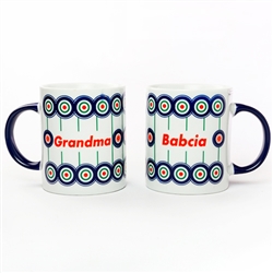 This attractive ceramic mug is decorated in a Boleslawiec motif.