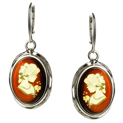 Incredibly beautiful silhouettes carved into Baltic honey amber, set in sterling silver, with hook and lever safety clasp.