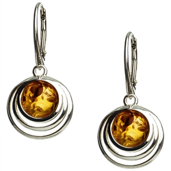 Honey amber balls wrapped in sterling silver circles.
Amber is soft, only slightly harder than talc, and should be treated with care.