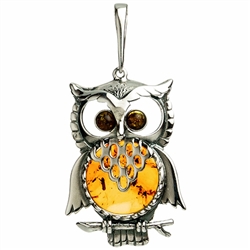 Our Polish sterling silver owl is highlighted with a nice round amber cabochon. Rooster size approx 2" x 1".