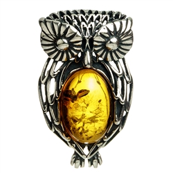 Our Polish sterling silver owl is highlighted with a nice oval amber cabochon. Size approx 1" x .75".