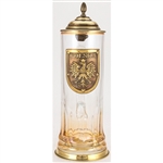 This unique glass stein has an antiqued bronze colored metal lid, thumblift, and base. The base of the glass features a permanent amber spray color. The center of the glass stein is decorated with an antiqued bronze colored medallion that reads POLSKA and