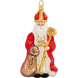 Masterfully crafted with shimmering, colorful glazes and detailed with sparkling glitter accents, this St. Nicholas ornament will add classic Christmas charm to your tree! Artfully crafted of glass from Poland, this charming Santa Claus ornament is 5.5" t