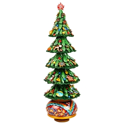 This beautifully decorated wooden tree is hand painted in Russia. Winding the cathedral clockwise plays the popular Russian melody, "Midnight In Moscow". Tree top star is removable for shipping.